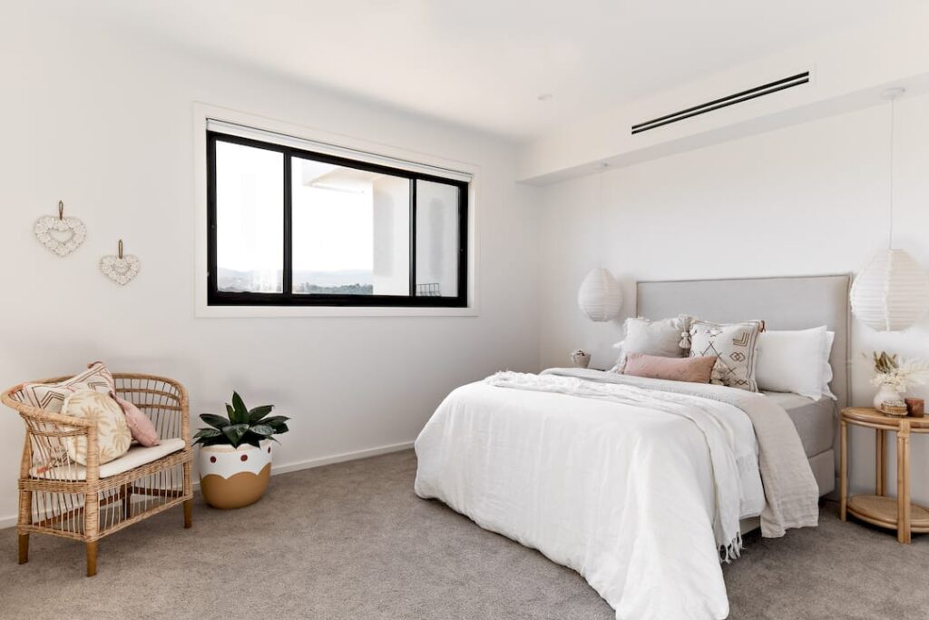 Couple measuring window for DIY blinds