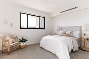 Couple measuring window for DIY blinds